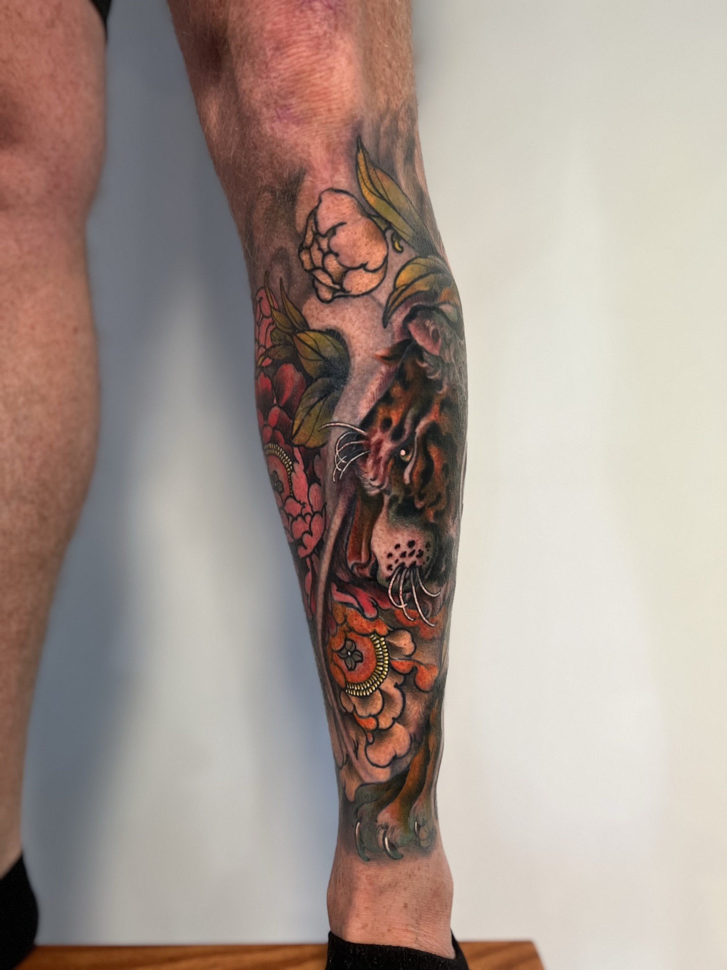 Neo-Japanese tiger and peony leg sleeve tattoo by Levi Taylor
